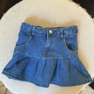 blue mini skirt with shorts underneath.